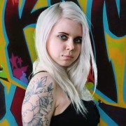 Young blonde woman with tattoos